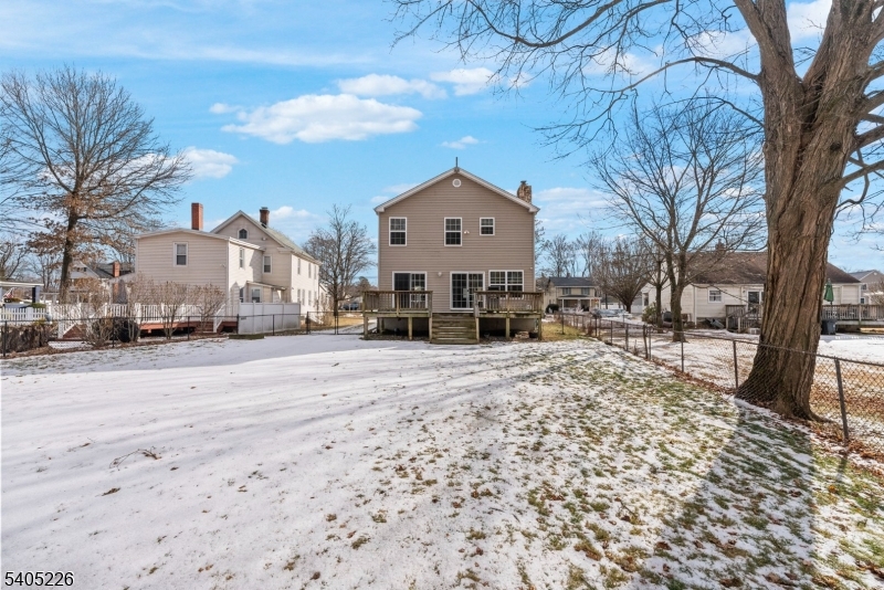 8 Kenvil Avenue Succasunna, NJ 07876 - Photo 20 of 21 a view of a house with a yard covered in snow