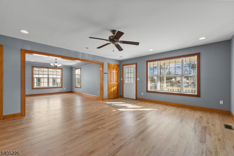 8 Kenvil Avenue Succasunna, NJ 07876 - Photo 3 of 21 a view of an empty room with a window and wooden floor