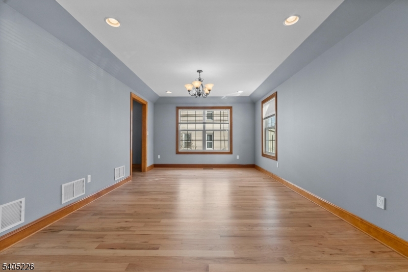 8 Kenvil Avenue Succasunna, NJ 07876 - Photo 4 of 21 wooden floor in an empty room with a window