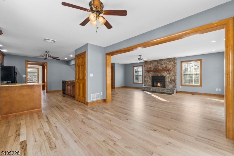 8 Kenvil Avenue Succasunna, NJ 07876 - Photo 7 of 21 a view of empty room with wooden floor and a fireplace