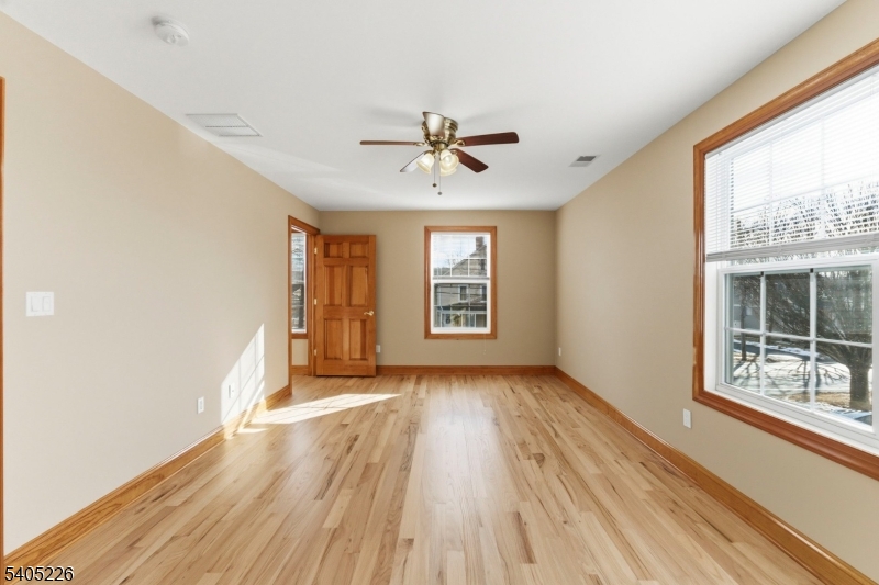 8 Kenvil Avenue Succasunna, NJ 07876 - Photo 10 of 21 wooden floor in an empty room with a window