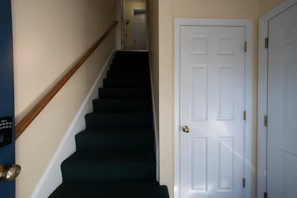 a view of a hallway with stairs