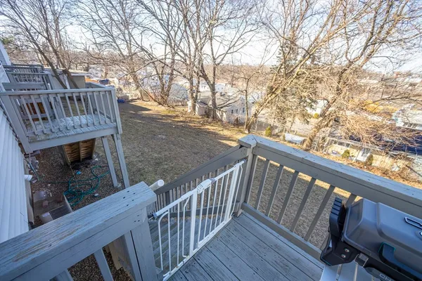 a view of balcony with wooden floor and outdoor space