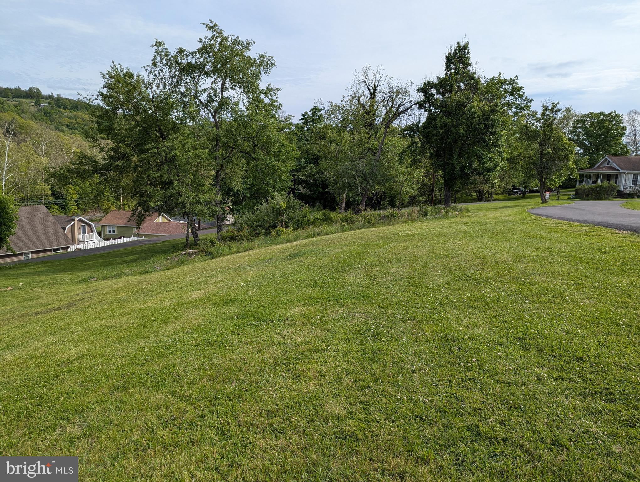 24001 Perry Hill Road Barton, MD 21521 - Photo 19 of 37 a view of a field of grass and trees