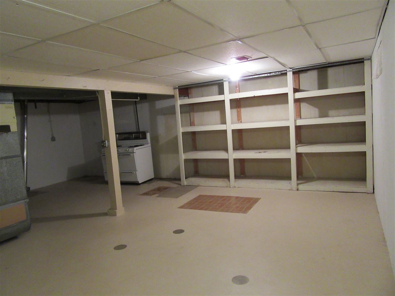 4045 Abbotsford Road Rockford, IL 61107 - Photo 13 of 18 a view of an empty room with a cabinet and a window