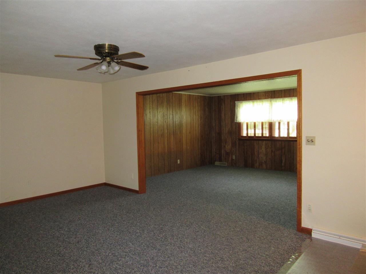 4045 Abbotsford Road Rockford, IL 61107 - Photo 2 of 18 an empty room with a empty space and windows