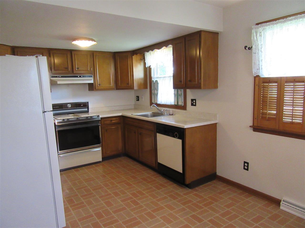 4045 Abbotsford Road Rockford, IL 61107 - Photo 5 of 18 a kitchen with a sink stove and microwave