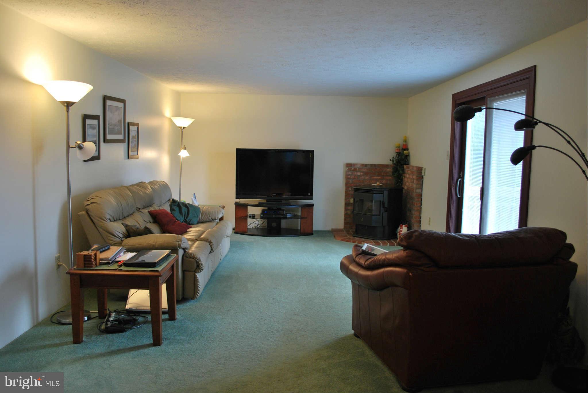 4309 Zircon Road Middletown, MD 21769 - Photo 8 of 22 a living room with furniture and a flat screen tv
