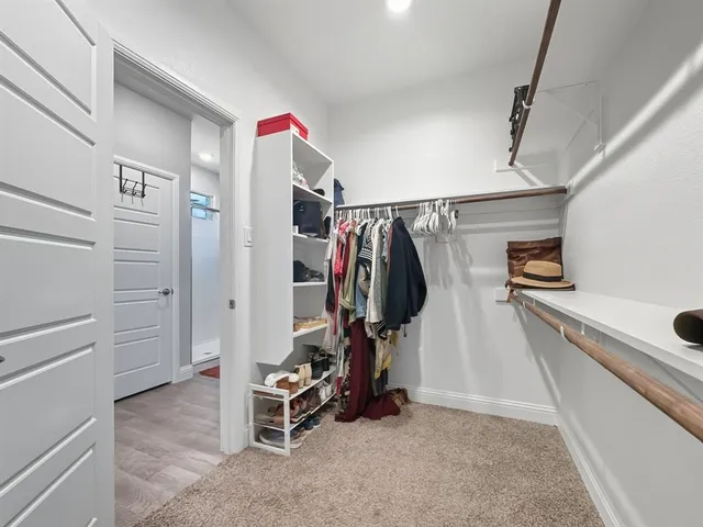 a bedroom with a bed and a desk