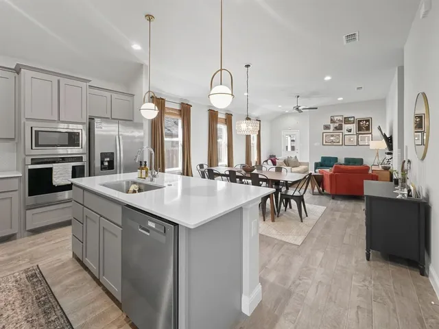 a bathroom with a sink a vanity and a mirror