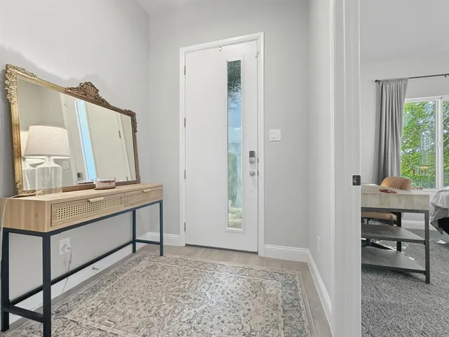 a view of a kitchen and an empty room