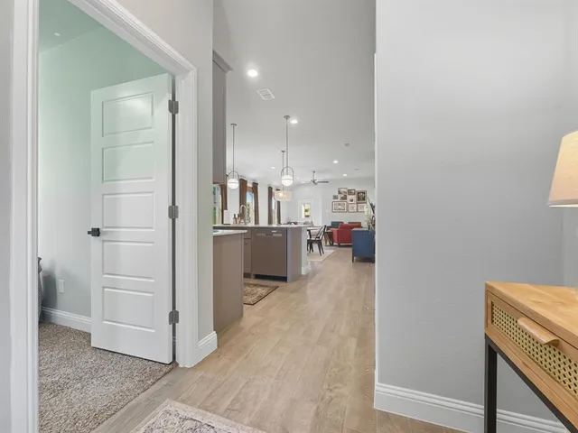 a kitchen with stainless steel appliances a sink stove and cabinets