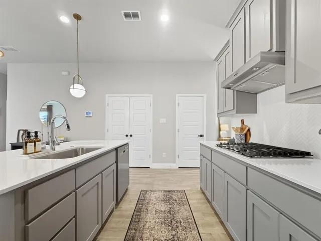 a view of a dining table chairs and chandelier