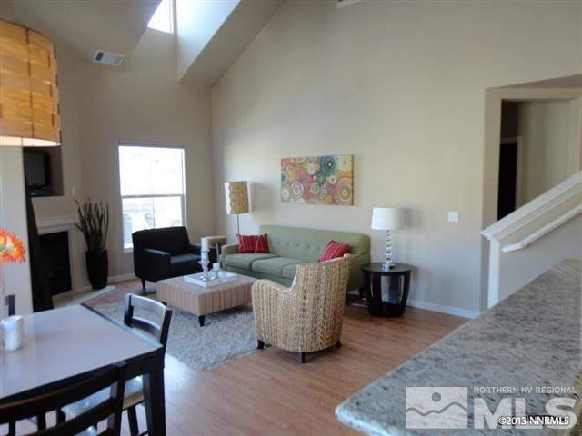 9050 Double R, Unit 1625 Reno, NV 89521 - Photo 1 of 1 a living room with furniture and a wooden floor