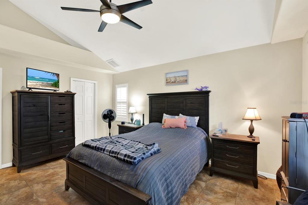 2021 Meadow Rue Court Trinity, FL 34655 - Photo 12 of 41 a bedroom with a bed and a dresser