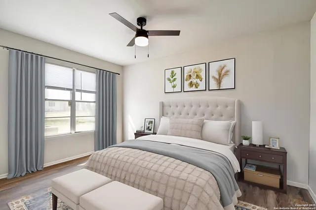 a bedroom with a large bed and a window