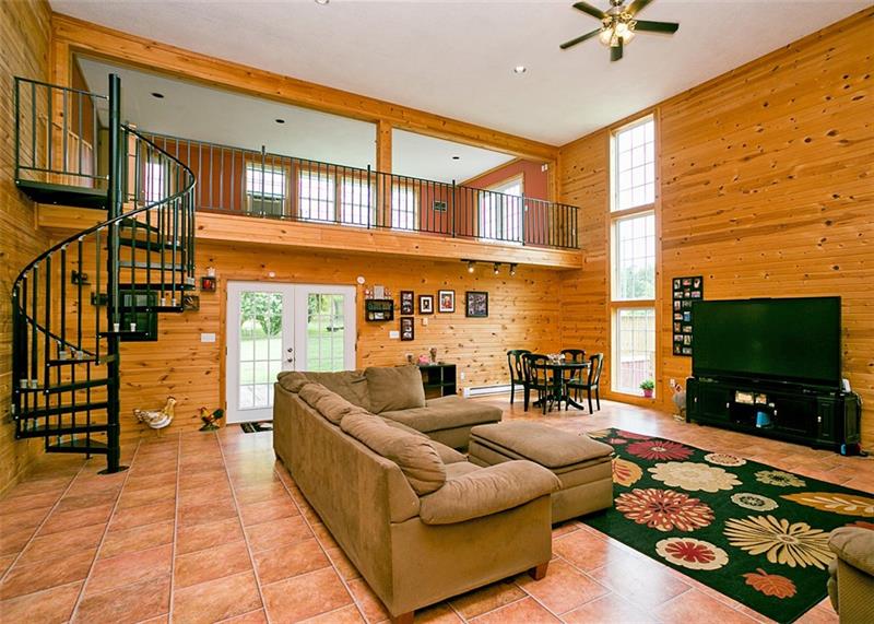 680 South Ridge Road Coal Center, PA 15423 - Photo 3 of 25 Huge Great Room with Spiral Stairs and wood burning fireplace!