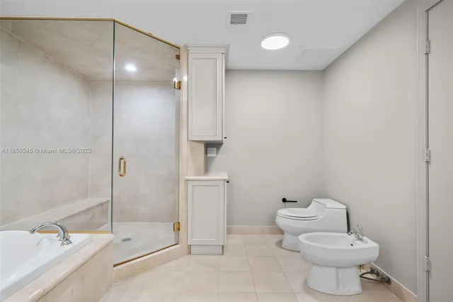 a bathroom with a toilet and a bathtub