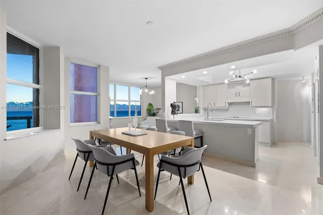 a view of a dining room with furniture and window