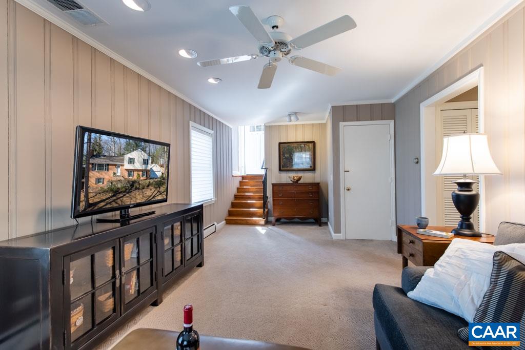 2412 Brook Road Charlottesville, VA 22901 - Photo 18 of 24 a living room with furniture and a flat screen tv