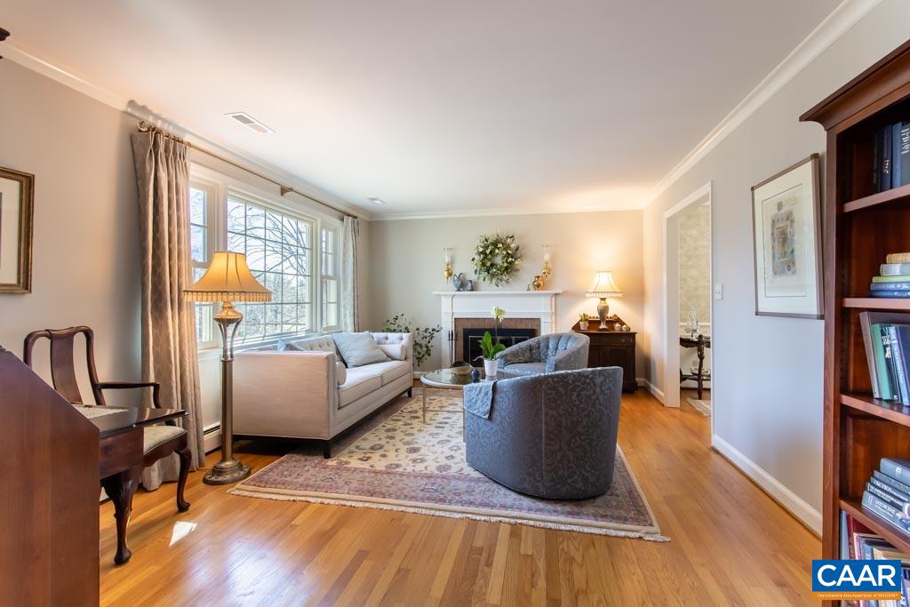 2412 Brook Road Charlottesville, VA 22901 - Photo 3 of 24 a living room with furniture window and wooden floor