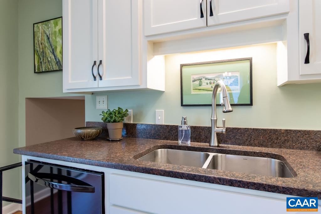 2412 Brook Road Charlottesville, VA 22901 - Photo 9 of 24 a kitchen with granite countertop a sink stainless steel appliances and cabinets