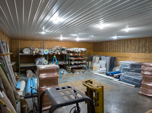 a living room with lots of furniture and a chandelier