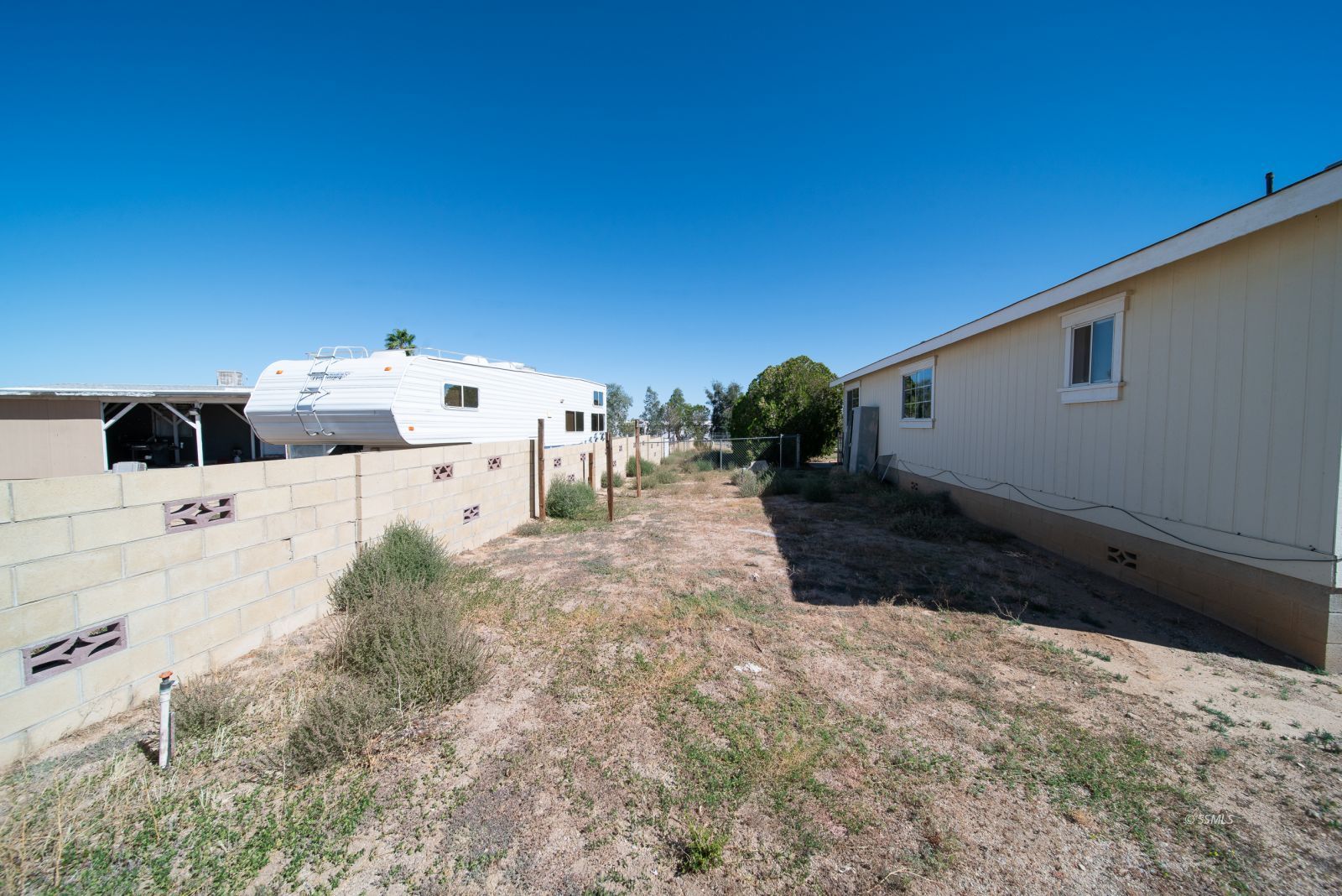 1219 South Garth Street Ridgecrest, CA 93555 - Photo 22 of 23 a view of a backyard with pathway