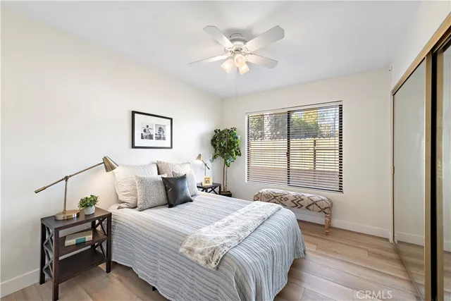 a bedroom with a large bed and a window