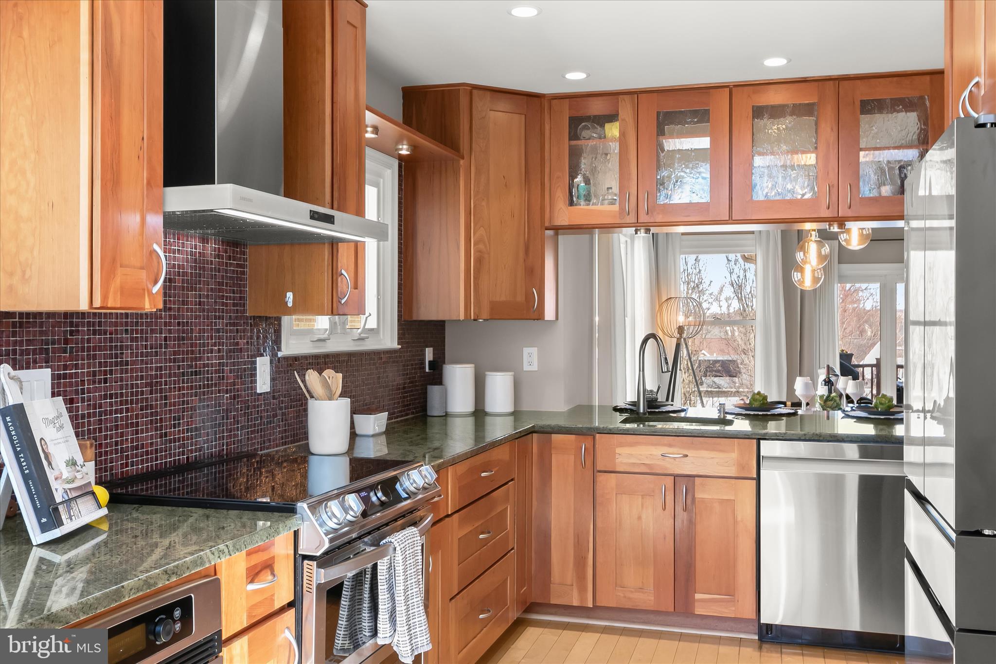 14215 Summit Lane Laurel, MD 20708 - Photo 12 of 62 a kitchen with stainless steel appliances granite countertop a stove a sink and a microwave
