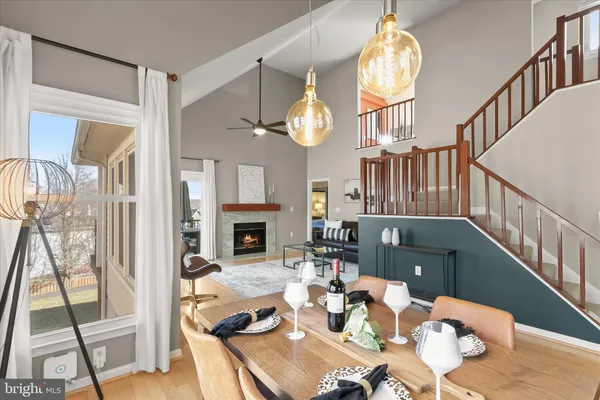 a living room with furniture fireplace and window