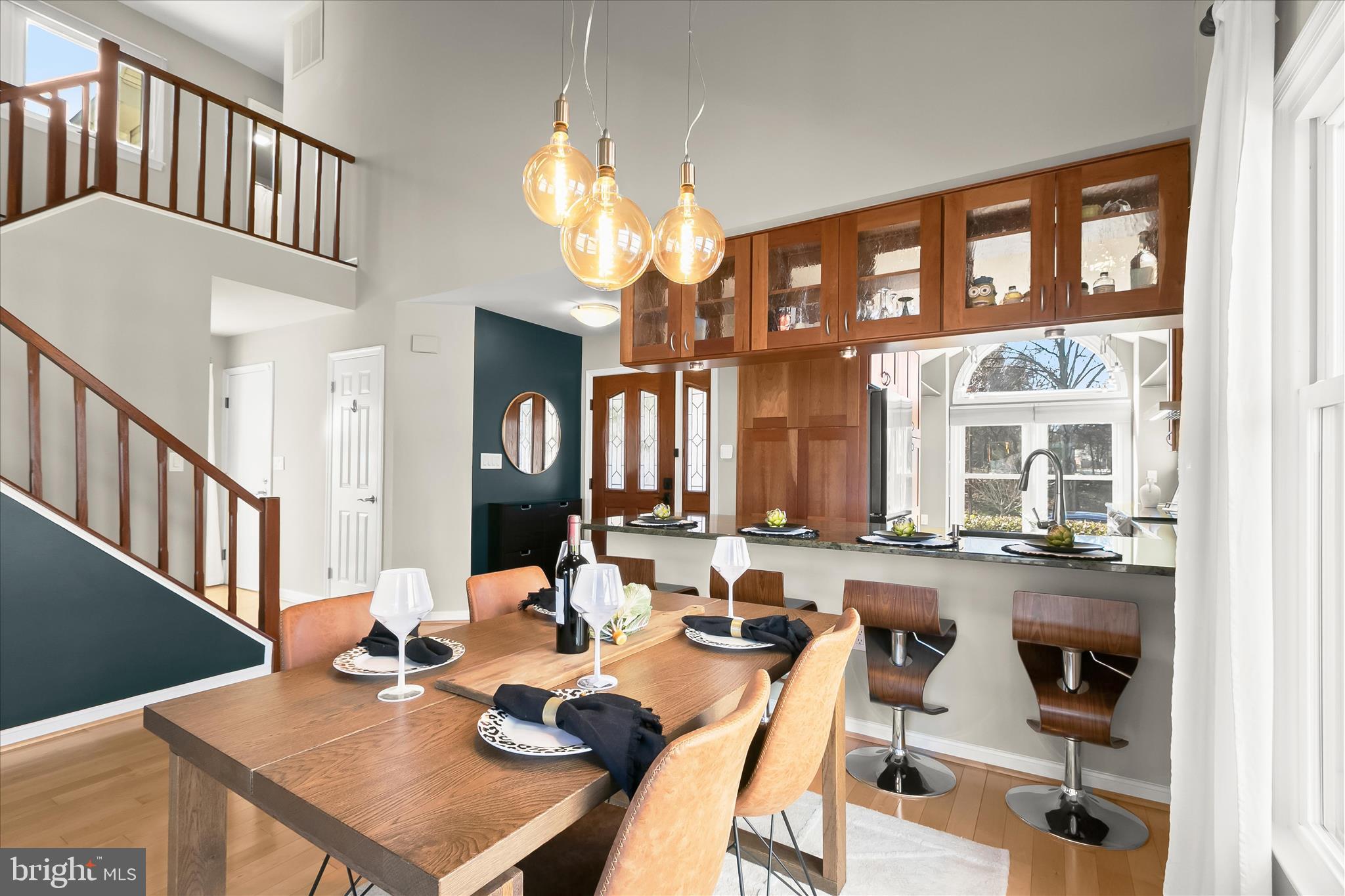 14215 Summit Lane Laurel, MD 20708 - Photo 17 of 62 a view of a dining room and livingroom with furniture large window and wooden floor