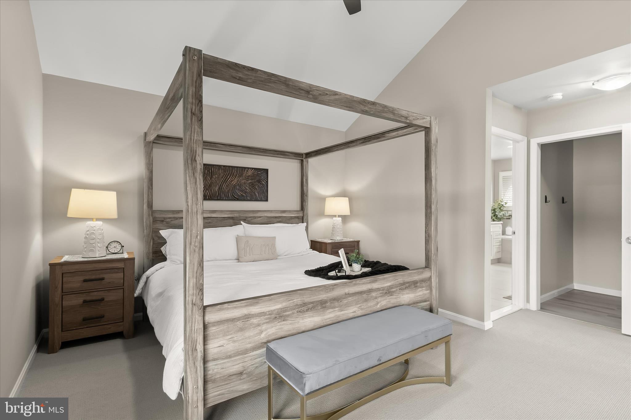 14215 Summit Lane Laurel, MD 20708 - Photo 26 of 62 a bedroom with a bed a mirror and lamp