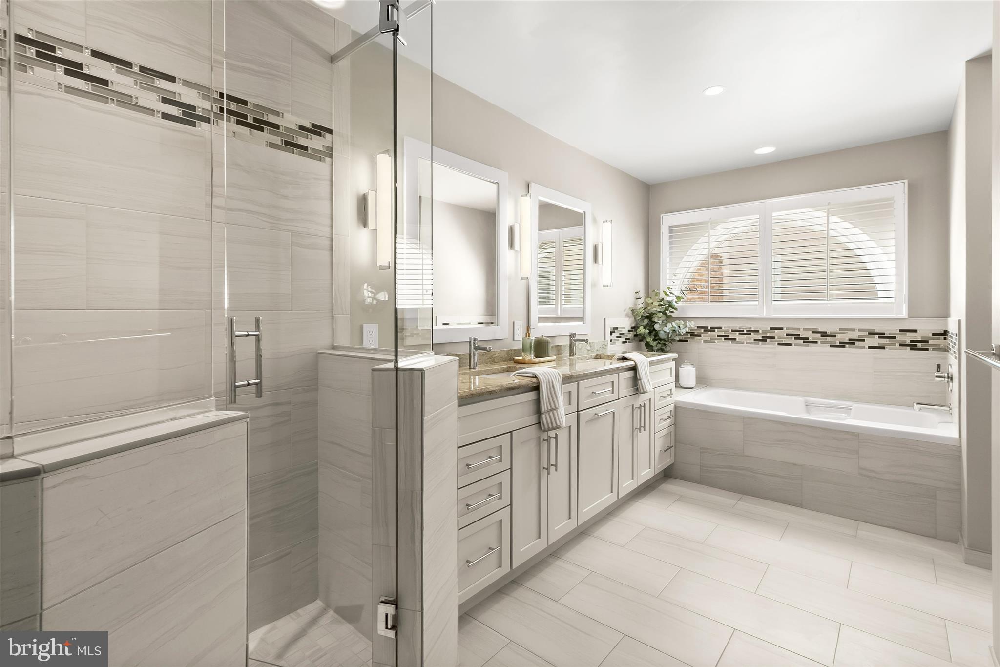 14215 Summit Lane Laurel, MD 20708 - Photo 29 of 62 a bathroom with a granite countertop shower a mirror and a bathtub