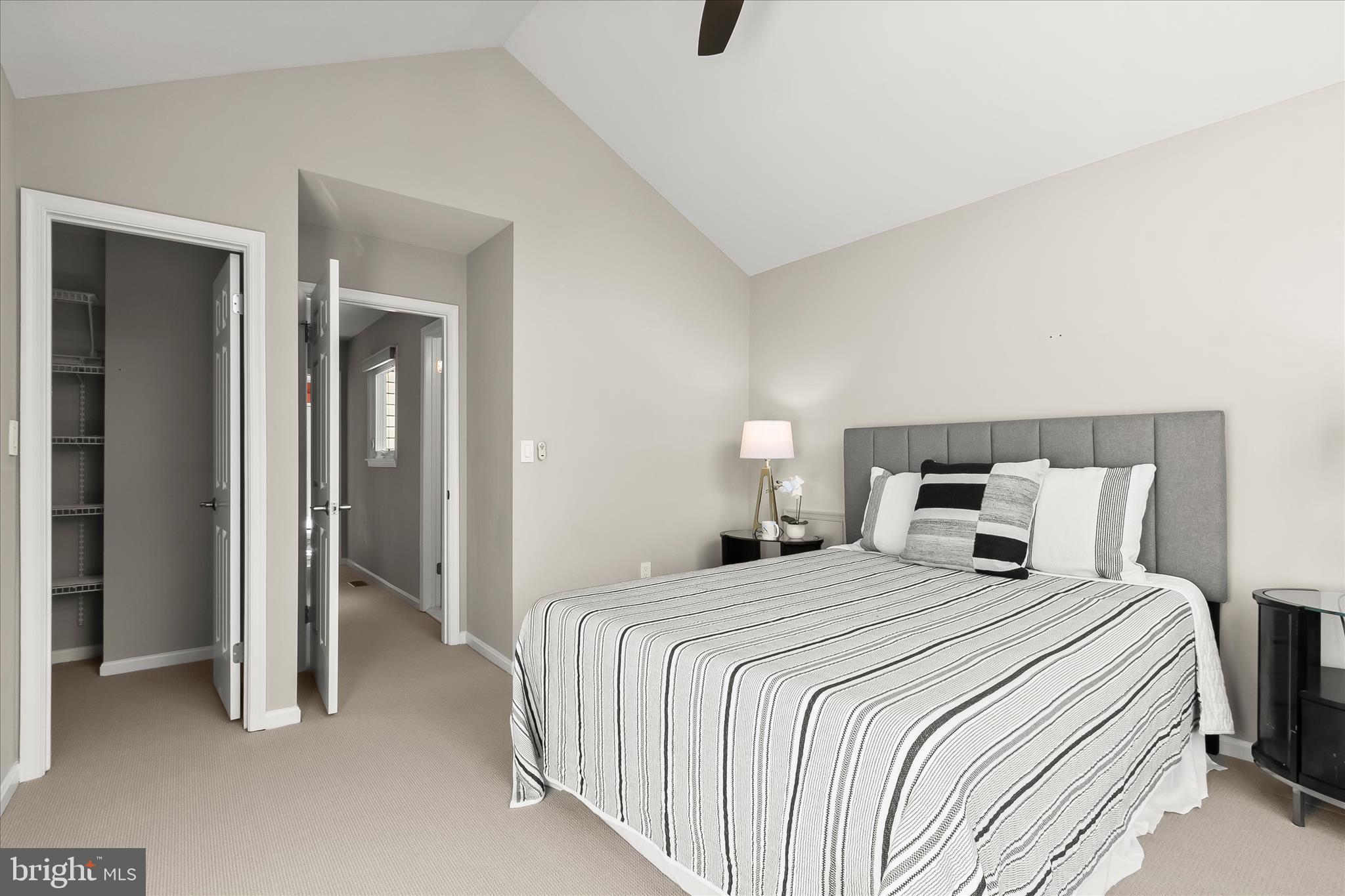 14215 Summit Lane Laurel, MD 20708 - Photo 34 of 62 a bedroom with a bed and a lamp