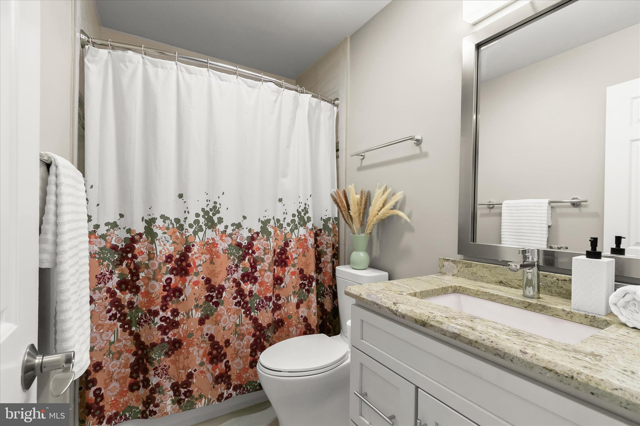 14215 Summit Lane Laurel, MD 20708 - Photo 35 of 62 a bathroom with a granite countertop sink and a mirror