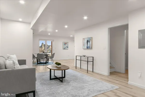 a large bedroom with a bed and a large mirror