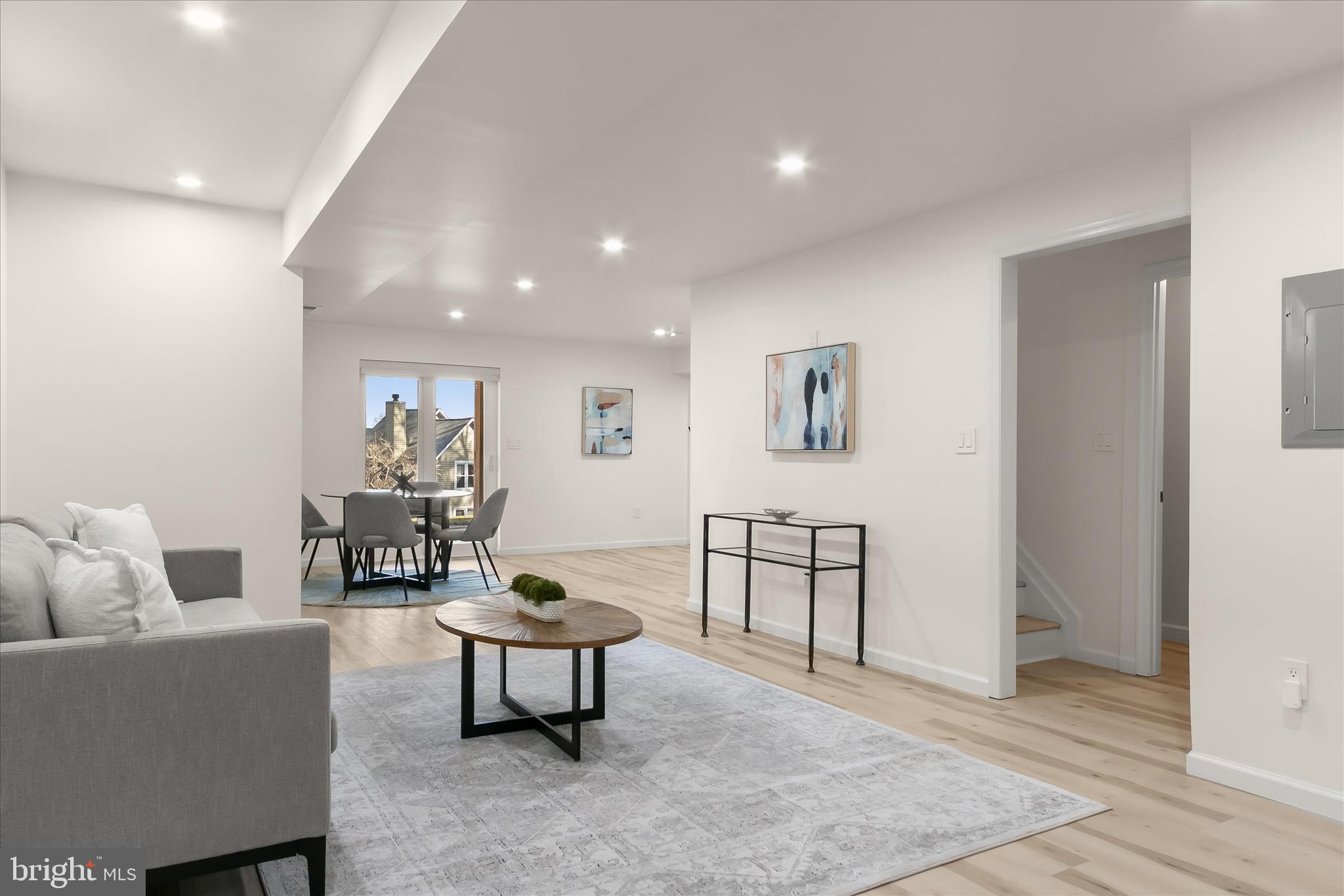 14215 Summit Lane Laurel, MD 20708 - Photo 40 of 62 a living room with furniture and a wooden floor