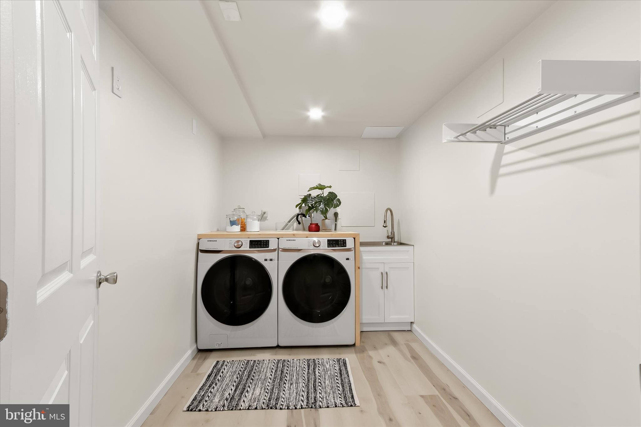 14215 Summit Lane Laurel, MD 20708 - Photo 43 of 62 a room with dryer and washer