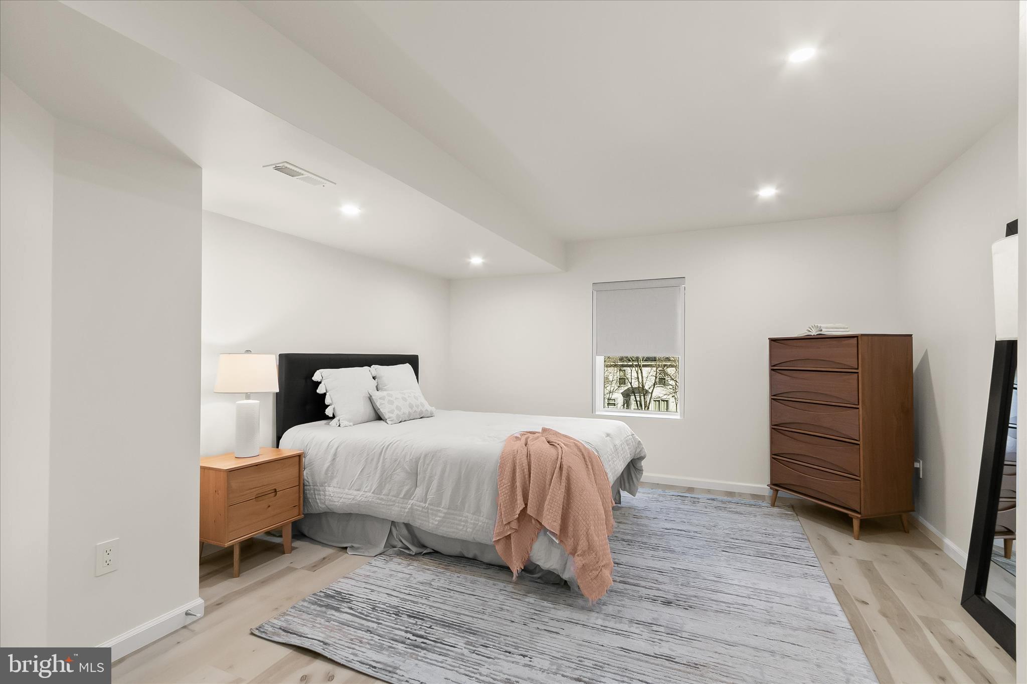 14215 Summit Lane Laurel, MD 20708 - Photo 47 of 62 a bedroom with a bed and cabinets