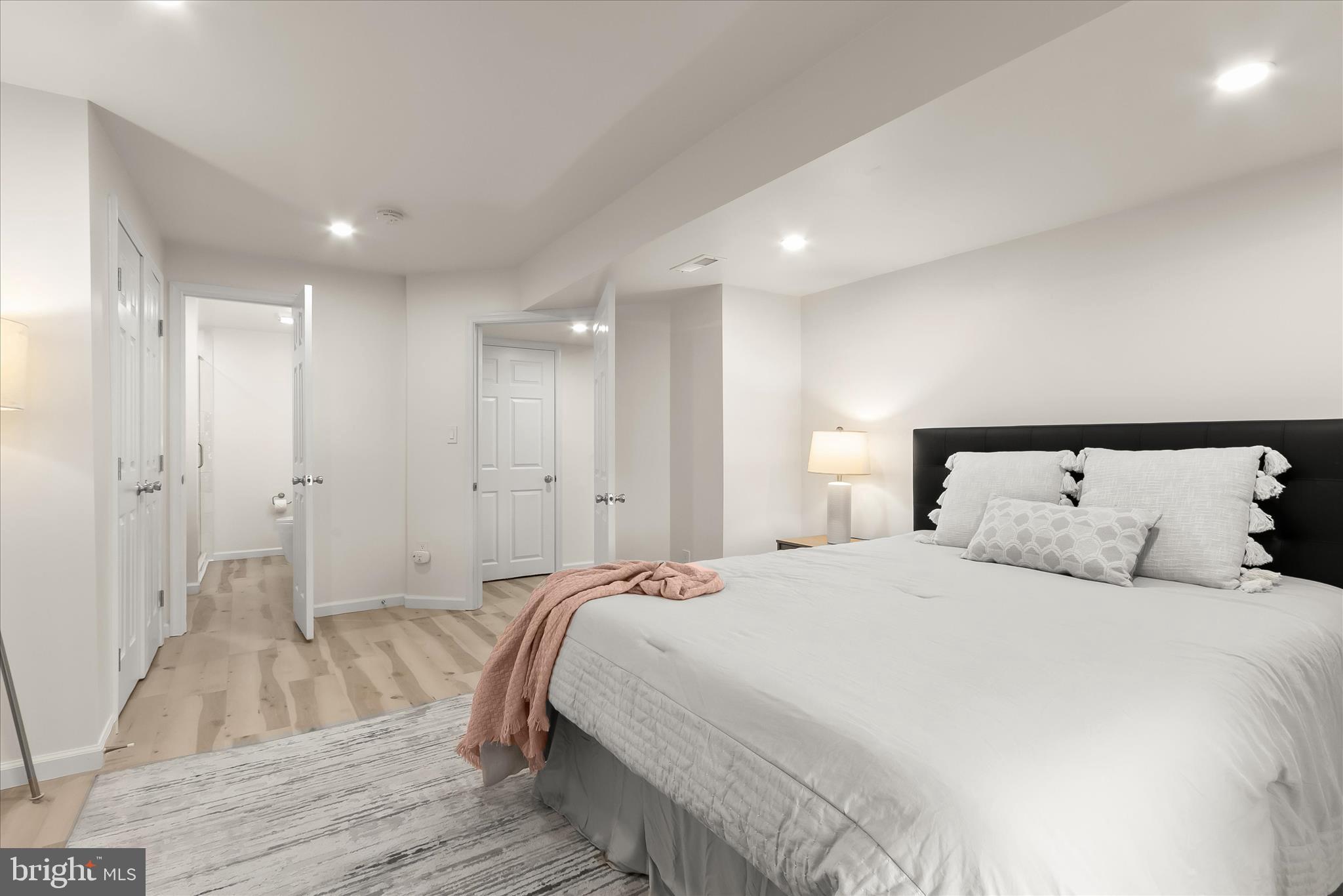 14215 Summit Lane Laurel, MD 20708 - Photo 49 of 62 a large bedroom with a bed and a large mirror