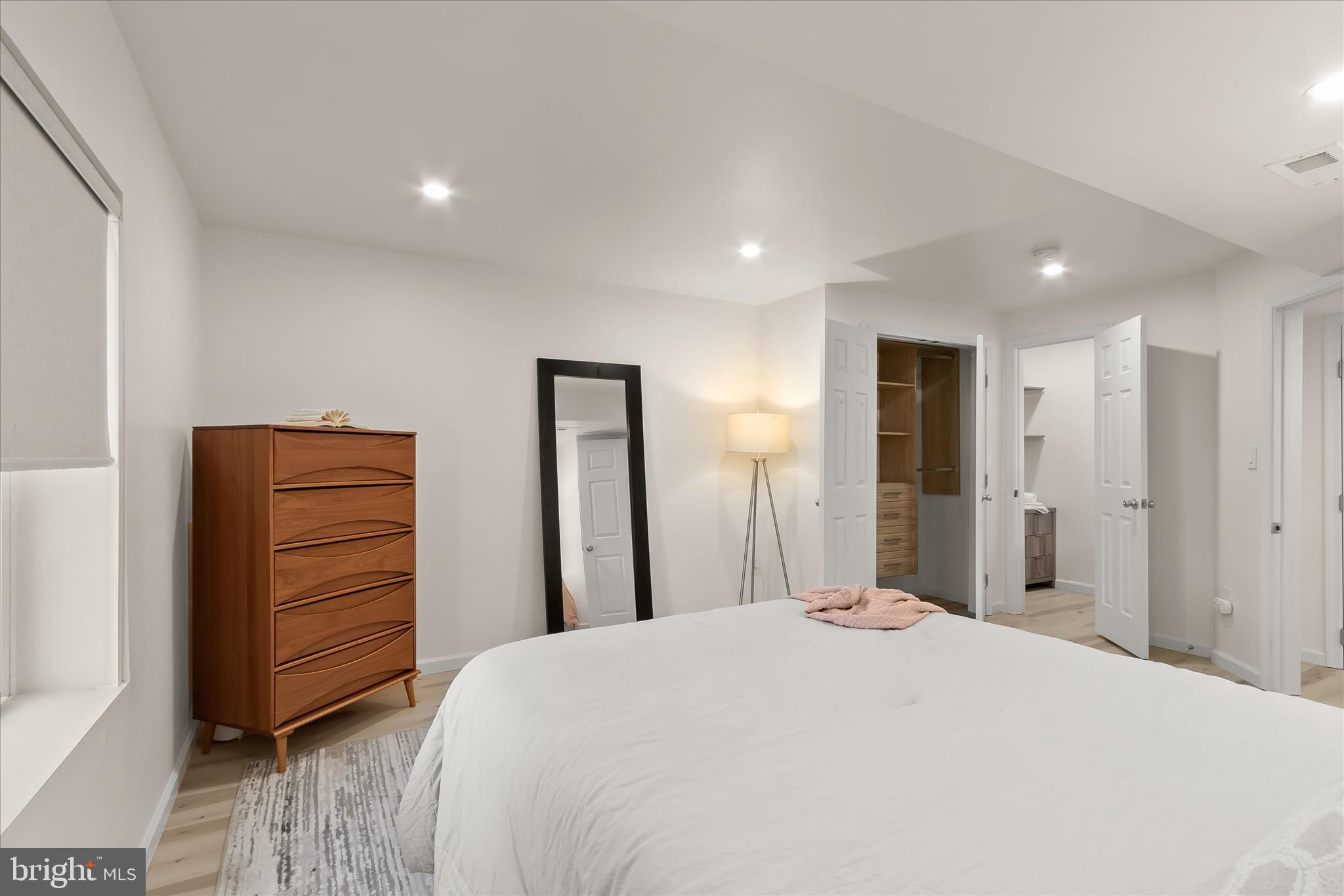 14215 Summit Lane Laurel, MD 20708 - Photo 50 of 62 a bedroom with a bed and a mirror