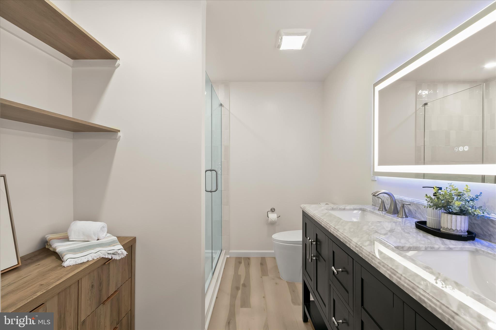 14215 Summit Lane Laurel, MD 20708 - Photo 51 of 62 a bathroom with a granite countertop sink a toilet and a mirror