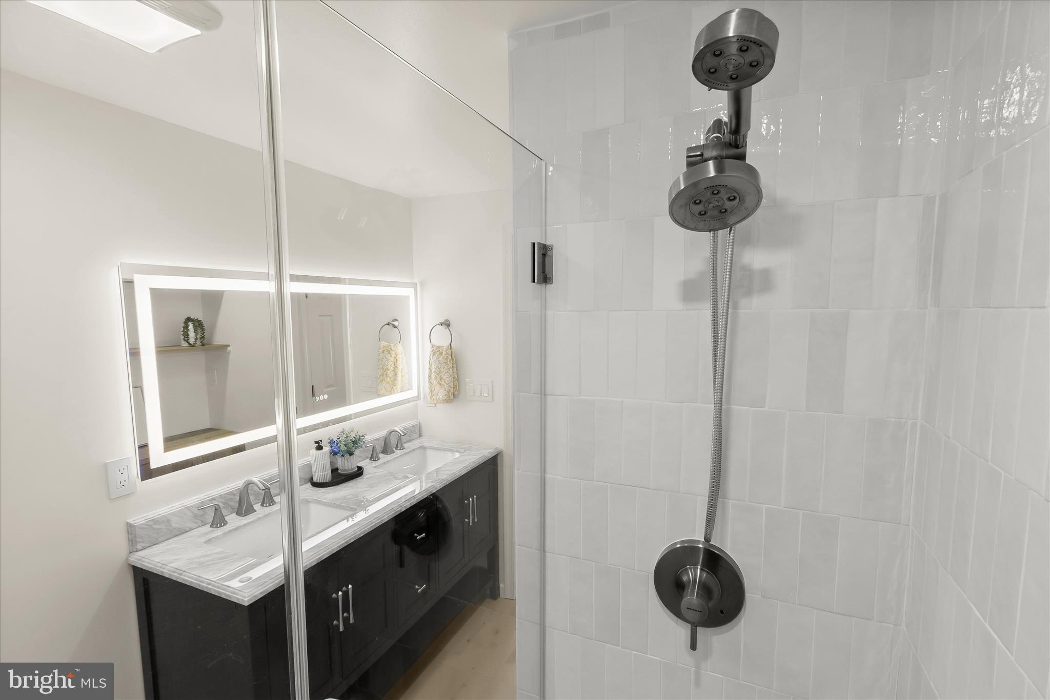 14215 Summit Lane Laurel, MD 20708 - Photo 53 of 62 a bathroom with a sink and a mirror