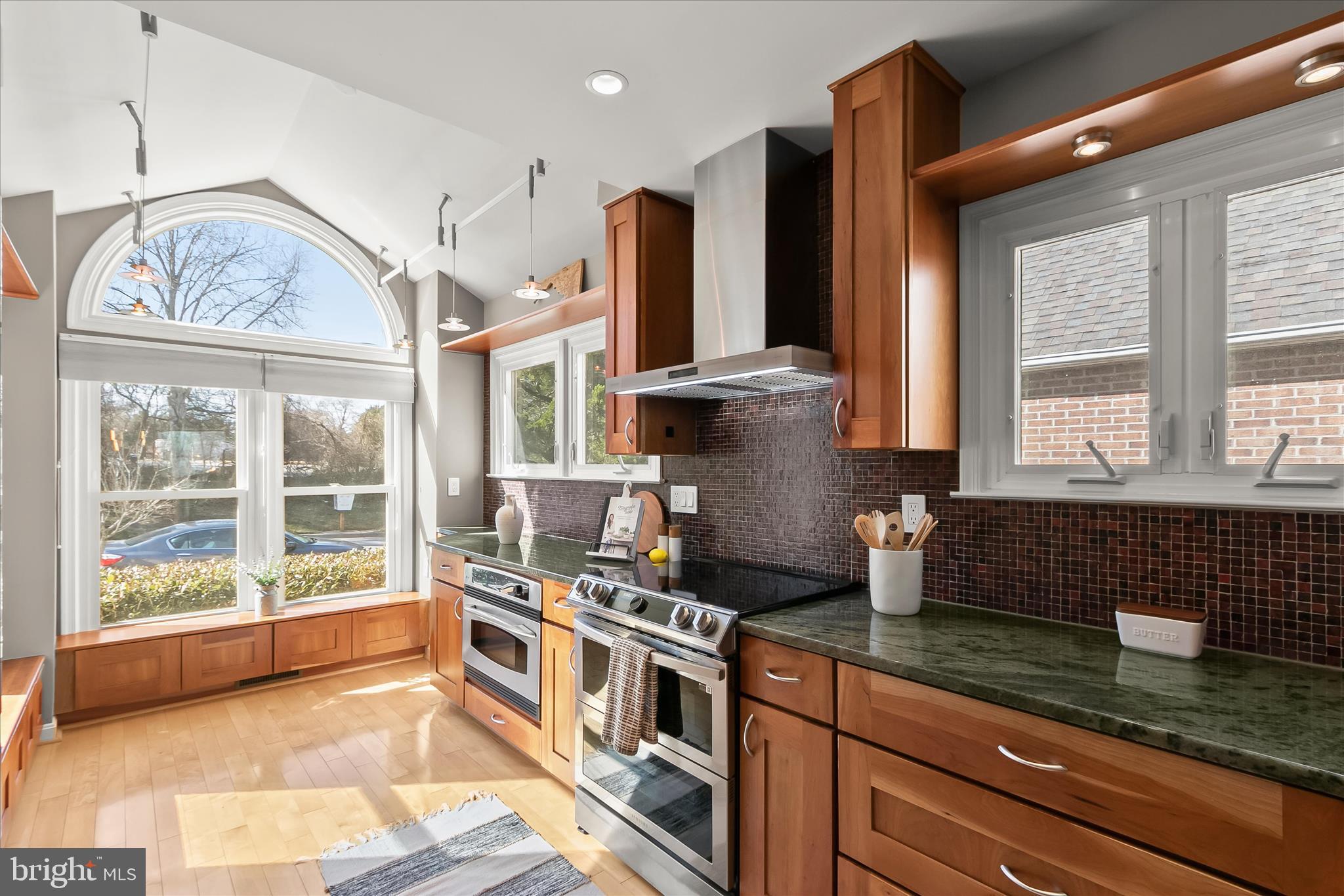 14215 Summit Lane Laurel, MD 20708 - Photo 8 of 62 a kitchen with stainless steel appliances granite countertop a stove a sink and a granite counter tops