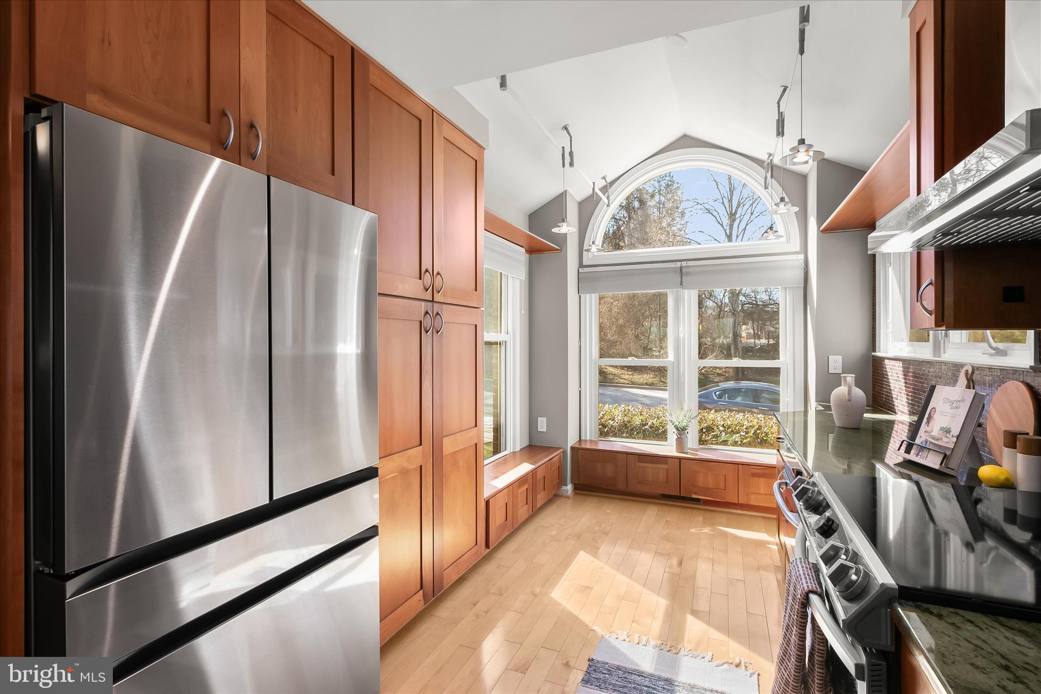 14215 Summit Lane Laurel, MD 20708 - Photo 9 of 62 a view of a kitchen with fridge and wooden floors