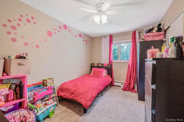 a bedroom with furniture and a chandelier