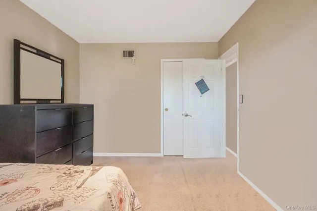 a bathroom with a sink double vanity and a mirror