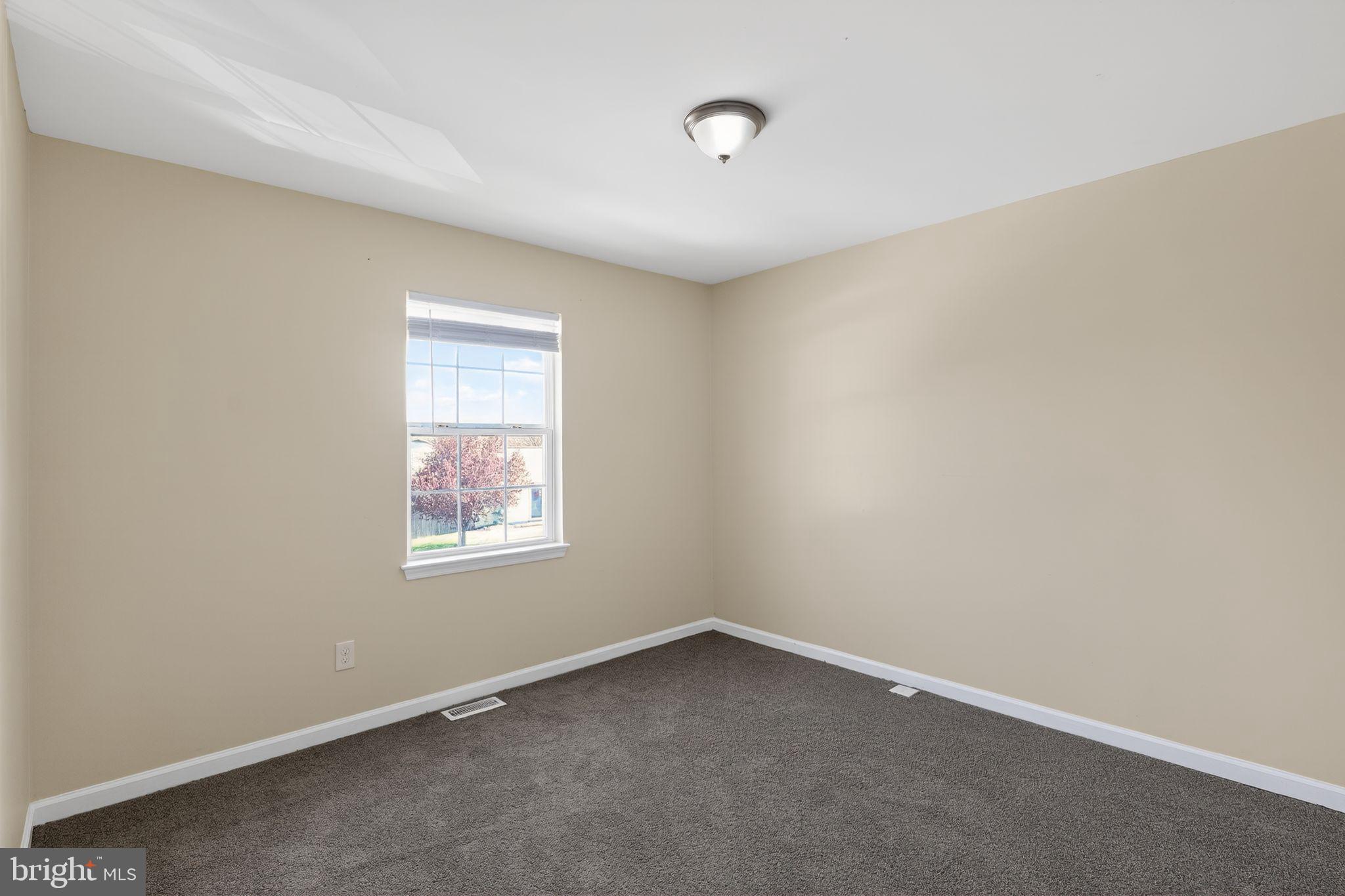 8090 Round Table Court Pasadena, MD 21122 - Photo 11 of 31 an empty room with a window