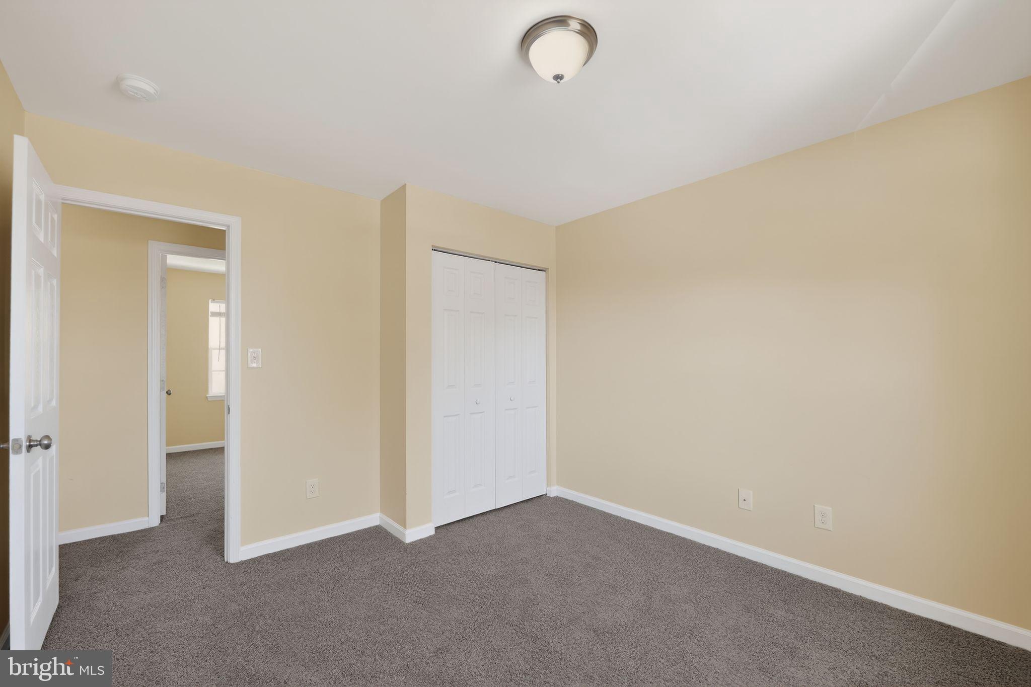 8090 Round Table Court Pasadena, MD 21122 - Photo 22 of 31 an empty room with closet area